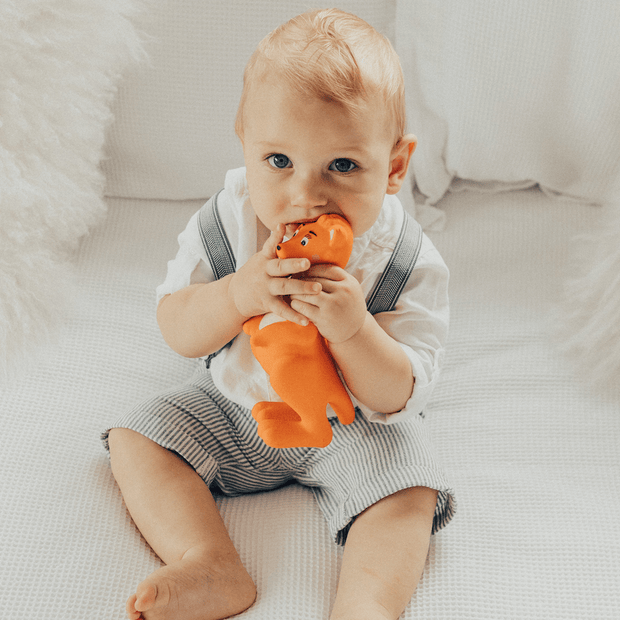 Baby playing with Mizzie The Kangaroo 100% Natural Rubber Teething Toy